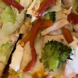 Hair in the pizza. (To the left of the broccoli you can see it) Hair in the pizza. (To the left of the broccoli you can see it)