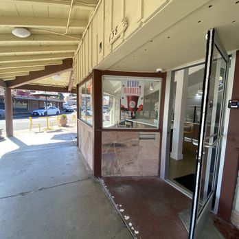 Gold Bean Cafe - Entrance. 2 outside tables at end. - Coffee & Tea Near Me - San Leandro, California
