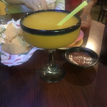 El Charro - a person sitting at a table with a bowl of mexican food - Mexican Near Me - West Plains, Missouri