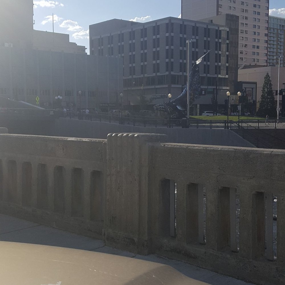 The Basement - View of the river and artwork by the parking lot. - Public Markets Near Me - Reno, Nevada
