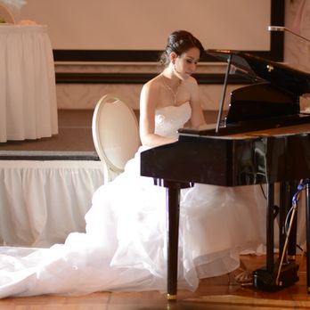 Triyarn Piano Studios - Janet Triyarn playing at her wedding. - Musical Instruments & Teachers Near Me Triyarn Piano Studios - Janet Triyarn playing at her wedding. - Musical Instruments & Teachers Near Me