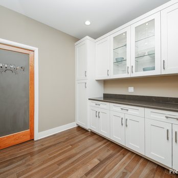 Lifestyle Homes - a kitchen with white cabinetry and wood floors - General Contractors Near Me Lifestyle Homes - a kitchen with white cabinetry and wood floors - General Contractors Near Me