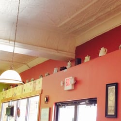 Fay's Evelyn Bay Coffee - Teapots above the entrance.