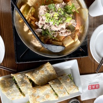 Northern Cafe - C1. Beef Roll (bottom) 1. Spicy Beef Pot (top) - Chinese Near Me - Irvine, California Northern Cafe - C1. Beef Roll (bottom) 1. Spicy Beef Pot (top) - Chinese Near Me - Irvine, California