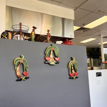 Nadia’s Jamaican Kitchen - a fridge with magnets on it - Caribbean Near Me - Brooklyn Park, Minnesota