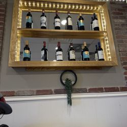 Sal's Famous Pizzeria - Wine displayed around the restaurant with more decore