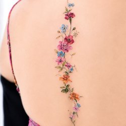 Baron Art Tattoo & Piercing Studio - Whole spine floral done by Tiffy.