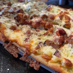 The World's End Brewpub and Inn - Pesto and bacon pizza.