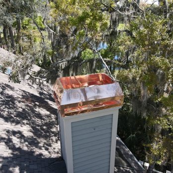 Jacksonville Chimney Pros - Copper chase cover and wind band. - Chimney Sweeps Near Me Jacksonville Chimney Pros - Copper chase cover and wind band. - Chimney Sweeps Near Me