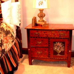 Painted Board Studio - Red dresser in bedroom