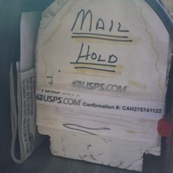 US Post Office - Crude plug in mail box to remind carrier there is a mail hold, fails to do the job.