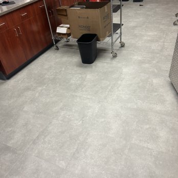 Zays Flooring - a kitchen with a table and a trash can - Flooring Near Me - Denver, Colorado Zays Flooring - a kitchen with a table and a trash can - Flooring Near Me - Denver, Colorado