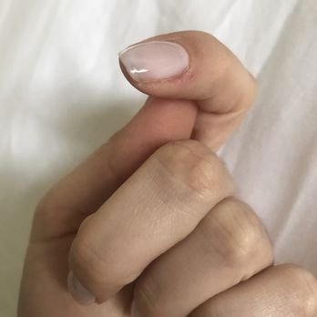 Evans Nails & Spa - Cuticles still rough and untrimmed. Blue polish under nail from week before. - Nail Salons Near Me - Evanston, Illinois
