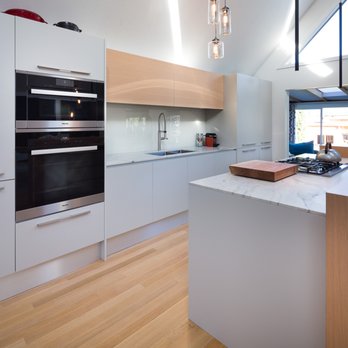 Fontile Kitchen & Bath - This beautiful natural oak stain paired with a light high pressure laminate in cement brings this West Vancouver kitchen project together. - Kitchen & Bath Near Me - Vancouver, British Columbia Fontile Kitchen & Bath - This beautiful natural oak stain paired with a light high pressure laminate in cement brings this West Vancouver kitchen project together. - Kitchen & Bath Near Me - Vancouver, British Columbia