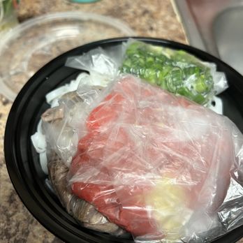 Pho Nguyen - a plate of food wrapped in plastic - Vietnamese Near Me - Houston, Texas Pho Nguyen - a plate of food wrapped in plastic - Vietnamese Near Me - Houston, Texas