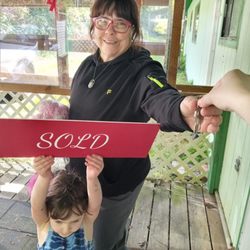 Amanda Niskanen - Keller Williams Realty - A proud grandmother getting the keys to her new vacation home on the coast!