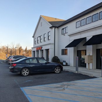 Dunkin' - a car parked in a parking lot - Coffee & Tea Near Me - Brewster, New York Dunkin' - a car parked in a parking lot - Coffee & Tea Near Me - Brewster, New York