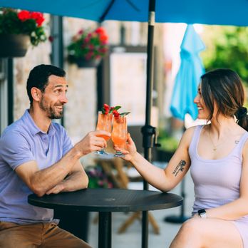 North Folk Cafe & Bakery - a man and woman toasting drinks - Cafes Near Me - Perth, Ontario