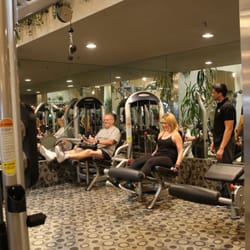 Fitness Results - Fitness Results trainer Julio training 2 baby boomers on leg day.