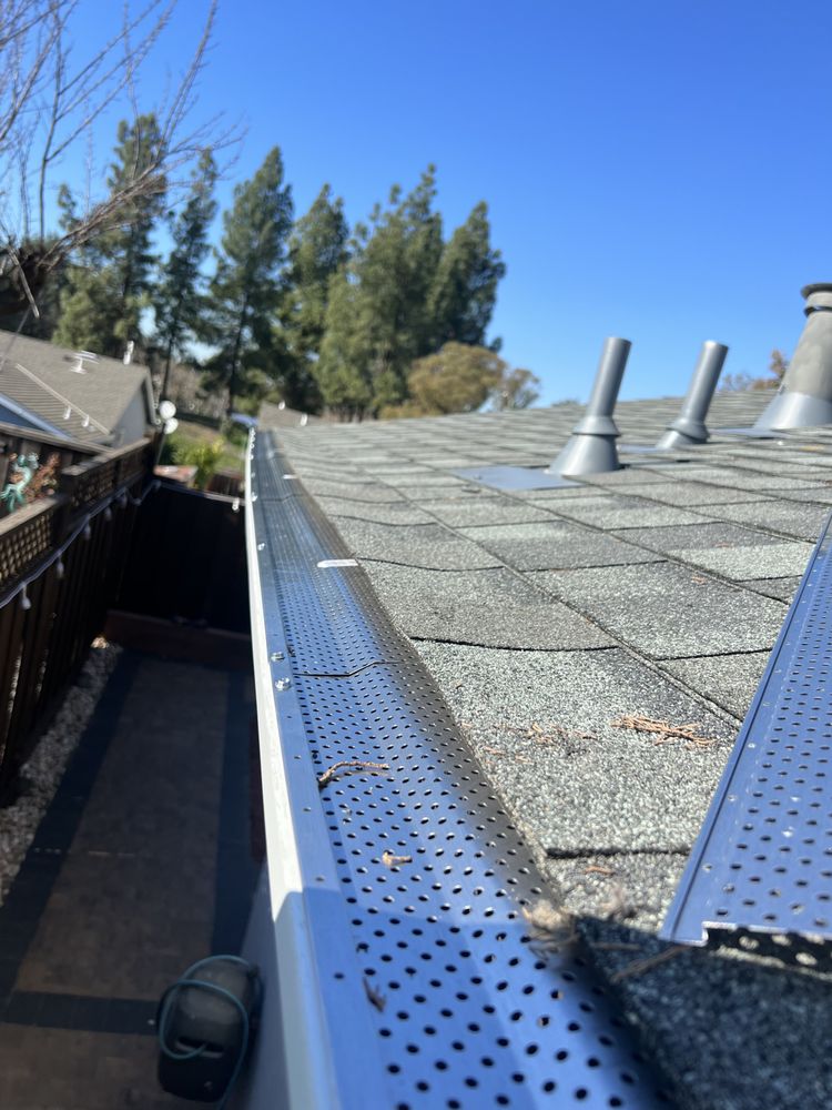 Slide of Pro Gutters cleaning and roofing 
