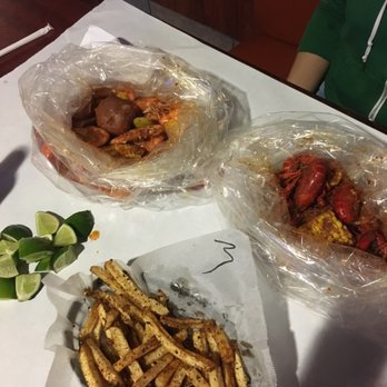 Seafood and Crawfish - Garlic butter shrimp and Cajun crawfish with Cajun fries. - Seafood Near Me - Riverside, California Seafood and Crawfish - Garlic butter shrimp and Cajun crawfish with Cajun fries. - Seafood Near Me - Riverside, California