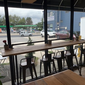 Roast'd Coffee - Fort Lee - Seating. And outside is a private parking lot. Convenient! - Coffee Roasteries Near Me - Fort Lee, New Jersey