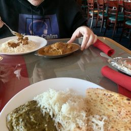 Shrimp saag, Kashmiri naan, lamb curry and basmati rice. Shrimp saag, Kashmiri naan, lamb curry and basmati rice.