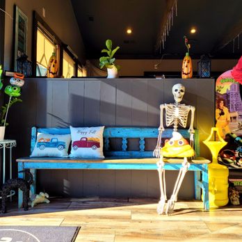 Tilted cafe - Skeleton party of one - Bars Near Me - Hiawassee, Georgia