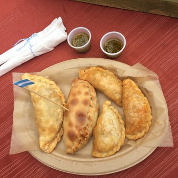 Alecocina - Here you have 3 smaller chicken empanadas, one humita and beef empanada. Ale, the owner, offers different sauces. - Food Trucks Near Me - Hillsboro , Oregon