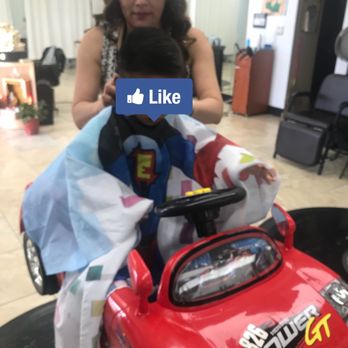 Kim's Salon - He Enjoy riding during haircut. - Hair Salons Near Me - Roseville, California