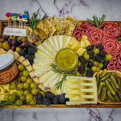 On Board Charcuterie & Catering - The Celebration Board!
Comes with keepsake acacia wood board.