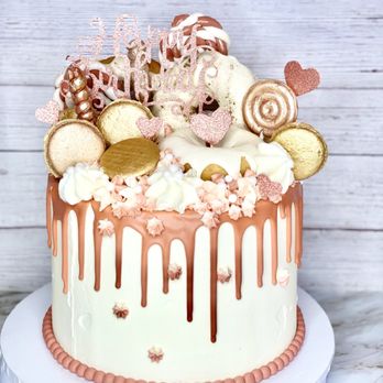 Sweets By Semi - Loaded Dusty Pink Drip Cake w Macarons/ Handmade Lollipops, and Donuts - Cupcakes Near Me