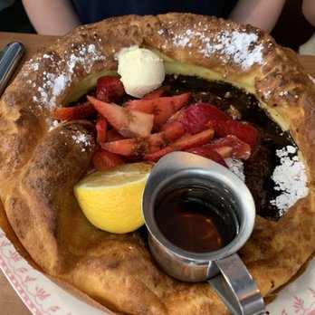 Sunday's Best - The "Dutch baby" with strawberries and a chocolate drizzle. - Breakfast & Brunch Near Me - Sandy, Utah Sunday's Best - The "Dutch baby" with strawberries and a chocolate drizzle. - Breakfast & Brunch Near Me - Sandy, Utah