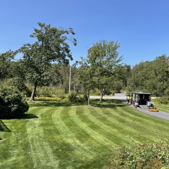 Two Brothers Lawn Care - two men mowing the lawn - Lawn Services Near Me Two Brothers Lawn Care - two men mowing the lawn - Lawn Services Near Me