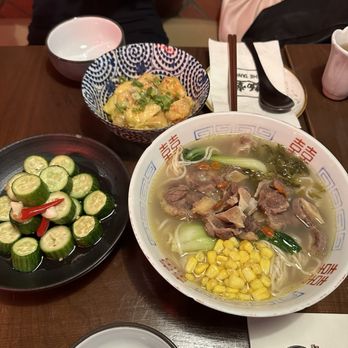 The Tang - Upper West Side - top: fried pork and chives dumplings $14, bottom left: marinated spicy cucumbers $11, bottom right: braised beef noodle soup $19 - Noodles Near Me - New York, New York