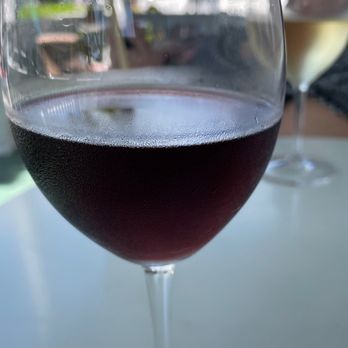 Grand Vin - a glass of wine on a table - Beer, Wine & Spirits Near Me - Key West, Florida