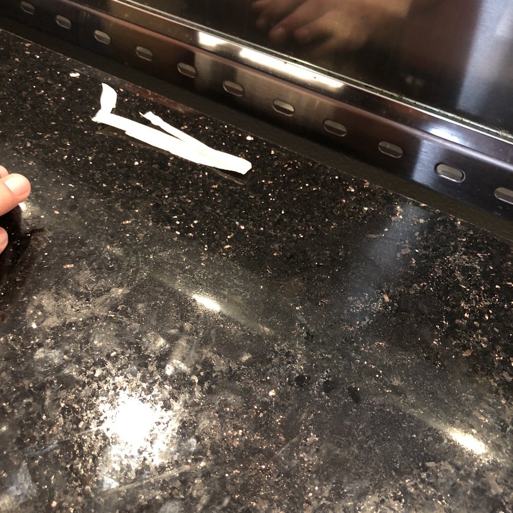 World Famous Boynton Beach - a person cleaning a counter top - New American Near Me - Boynton Beach, Florida World Famous Boynton Beach - a person cleaning a counter top - New American Near Me - Boynton Beach, Florida