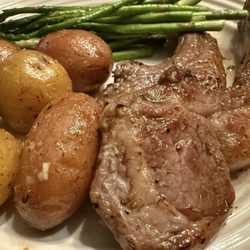 NVF Speciality Cuisine - Lambchop, baby golden potatoes, and crispy asparagus