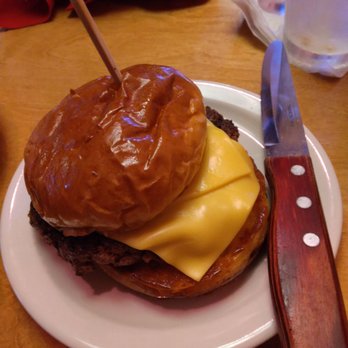 Texas Roadhouse - Barely melted cheese on a hastily thrown together burger - Barbeque Near Me - Carmel, Indiana