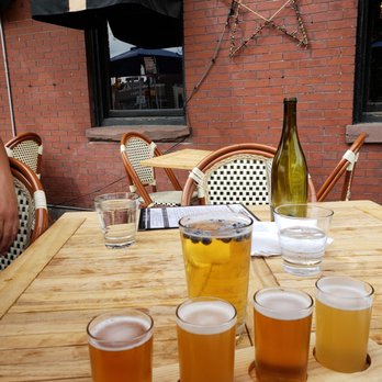 Cobblestones - A flight and blueberry beer on the patio - Bars Near Me - Lowell, Massachusetts