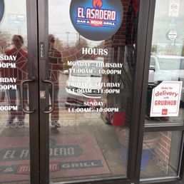 Exterior outside entrance of El Asadero - Hours on the door - Huber Heights, Ohio Exterior outside entrance of El Asadero - Hours on the door - Huber Heights, Ohio