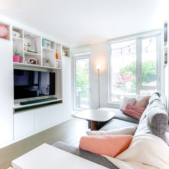 California Closets - White media unit with storage above the TV for decorative items - California Closets in Vancouver, BC - Interior Design Near Me - Vancouver, British Columbia California Closets - White media unit with storage above the TV for decorative items - California Closets in Vancouver, BC - Interior Design Near Me - Vancouver, British Columbia