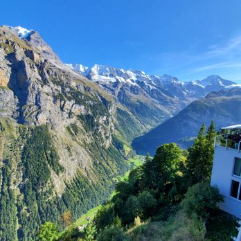 Hotel Edelweiss Mürren - Gorgeous mountain view from my terrace. Off to the side, you can see the rest of the hotel as well as a little bit of the terrace restaurant - Hotels & Travel Near Me - Mürren, BE Hotel Edelweiss Mürren - Gorgeous mountain view from my terrace. Off to the side, you can see the rest of the hotel as well as a little bit of the terrace restaurant - Hotels & Travel Near Me - Mürren, BE
