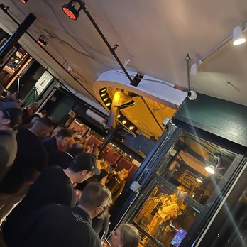 One Pelham East - Live music and view of the front of the place seated at the windows over looking the street - Music Venues Near Me - Newport, Rhode Island