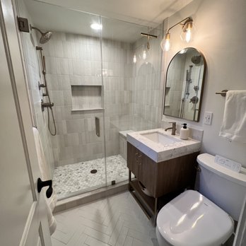 Somerset West Inc - a bathroom with a shower, toilet, and sink - General Contractors Near Me Somerset West Inc - a bathroom with a shower, toilet, and sink - General Contractors Near Me