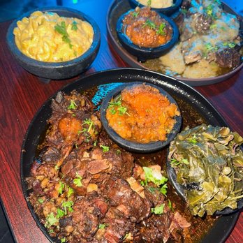 Jordyn's Brunch Cafe - Oxtail, with candied yams and okra. Along with beef short ribs accompanied by candied yams and mashed potatoes. - Soul Food Near Me - Chicago, Illinois Jordyn's Brunch Cafe - Oxtail, with candied yams and okra. Along with beef short ribs accompanied by candied yams and mashed potatoes. - Soul Food Near Me - Chicago, Illinois