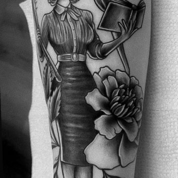 Sueno Tattoo - Vintage-style pin-up woman with wavy hair holding a watering can surrounded by flowers and plants in black and grey on the arm - Tattoo Near Me - Silver Spring, Maryland Sueno Tattoo - Vintage-style pin-up woman with wavy hair holding a watering can surrounded by flowers and plants in black and grey on the arm - Tattoo Near Me - Silver Spring, Maryland
