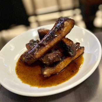 Hilltop Kitchen & Bar - Home style ribs appetizer - dirty honey flavor - Wine Bars Near Me - Syosset, New York Hilltop Kitchen & Bar - Home style ribs appetizer - dirty honey flavor - Wine Bars Near Me - Syosset, New York