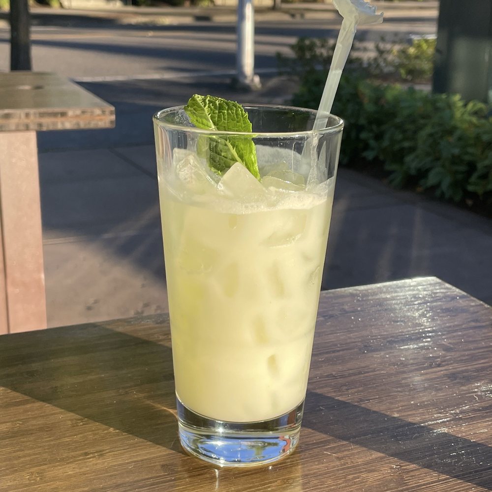 Khao Yai Thai Kitchen - A coconut mojito to compliment an 80 degree day! A fun touch with the handmade flower straw. - Thai Near Me - Beaverton, Oregon Khao Yai Thai Kitchen - A coconut mojito to compliment an 80 degree day! A fun touch with the handmade flower straw. - Thai Near Me - Beaverton, Oregon
