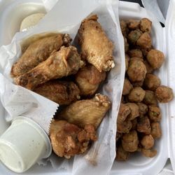 Macland Wings & More - 10 piece Chicken wings with lemon pepper sauce and ranch on the side with huge side of fried okra cooked to perfection!